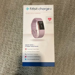 Purple and rose gold Fitbit Charge 2. Worn once.